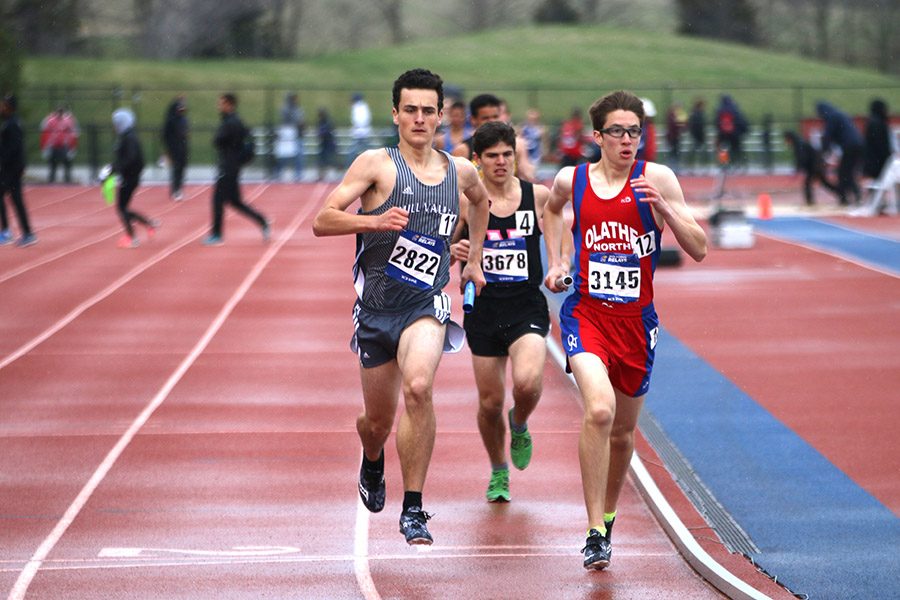 In second place, junior Matthew Turner tries to pass an Olathe Northwest runner on Saturday, April 21. 