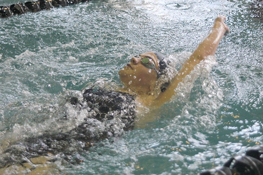 Sophomore Hannah Davie swims the backstroke portion of the 200-yard individual medley race.