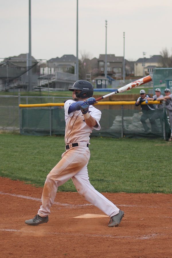 As the ball comes towards him, junior Quinton Hall swings for a hit on Tuesday, April 24.