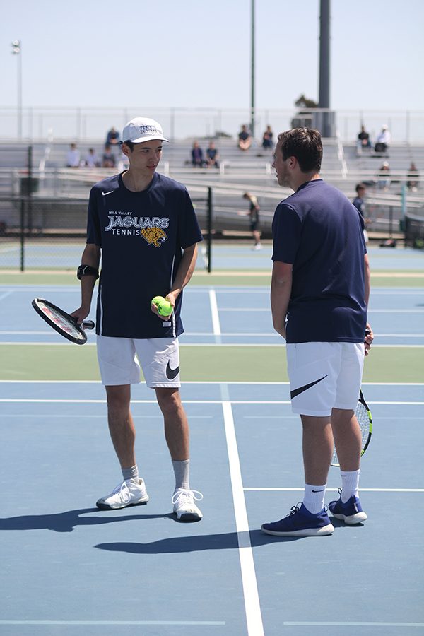 During a match, doubles partners junior Jacob Hoffman and senior Drake Brizendine talk about what to do next.