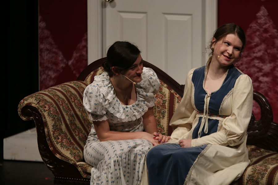 Charlotte, played by junior Abby Hoepner, smiles as Elizabeth, played by senior Julia Feuerborn, speaks while at Lady Catherine's estate.
