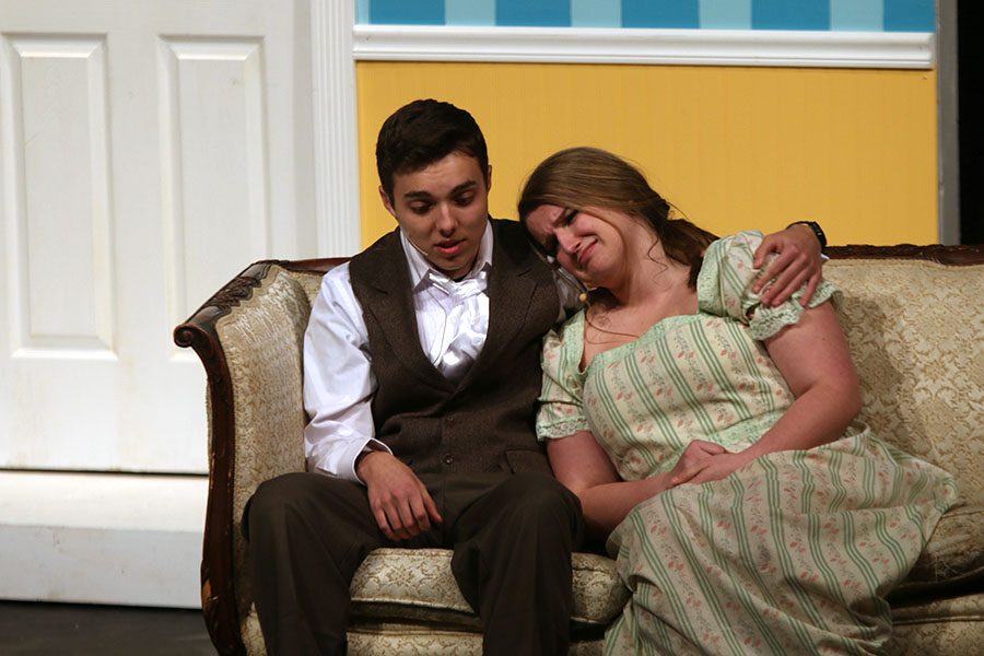 Mr. Bennet, played by junior Joe McClain, comforts Mrs. Bennet, played by sophomore Ashley Grega. 