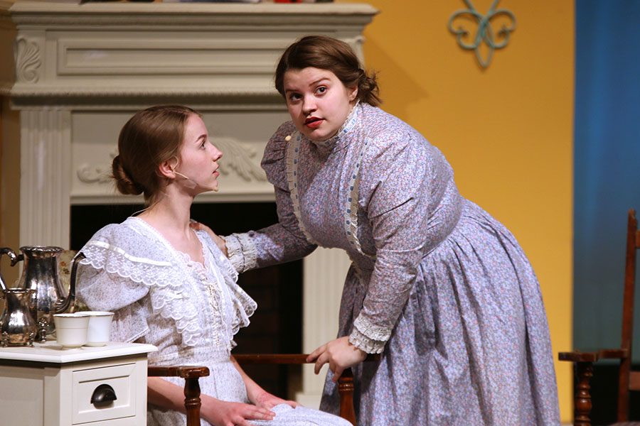 Mrs. Bennet, played by senior Lindsey Edwards, speaks to her daughter Jane, played by junior Annika Lehan. 