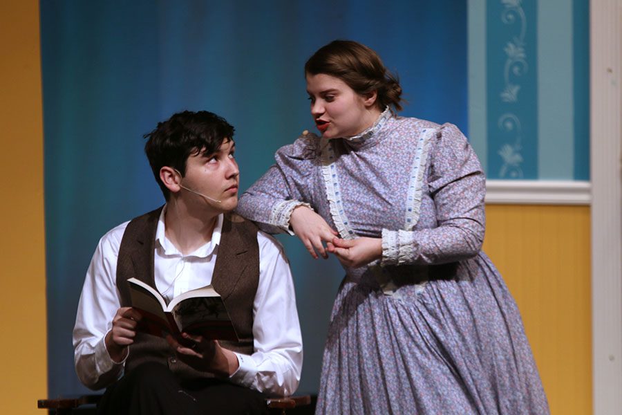 During dress rehearsal for the spring play Pride and Prejudice, Mr. Bennet, played by senior Graham Wilhauk, looks up at his wife Mrs. Bennet, played by junior Lindsey Edwards, while the two talk about marriage. Pride and Prejudice will run from April 24 to April 27.