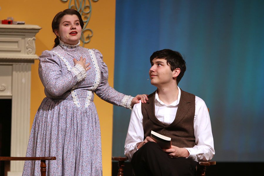Mrs. Bennet, played by junior Lindsey Edwards, talks about marrying her daughters with her husband Mr. Bennet, played by senior Graham Wilhauk.