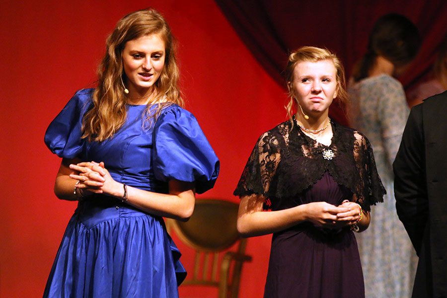 Louisa, played by sophomore Annie Bogart, speaks to her sister Caroline, played by sophomore Camryn Vitt, at a ball.