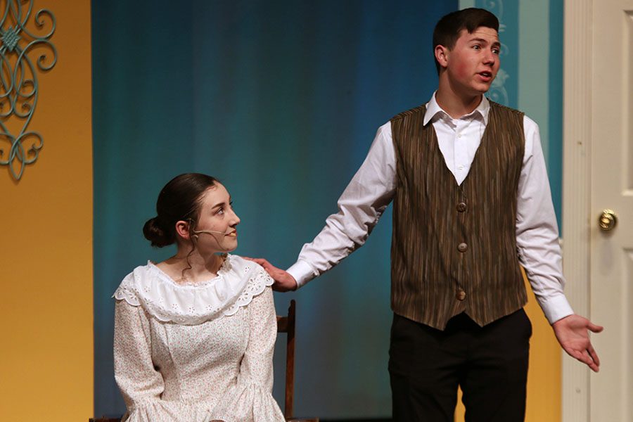Sir William Lucas, played by junior Jack Jaworski, speaks to the Bennets along with Lady Lucas, played by junior Analiese Wilhauk.