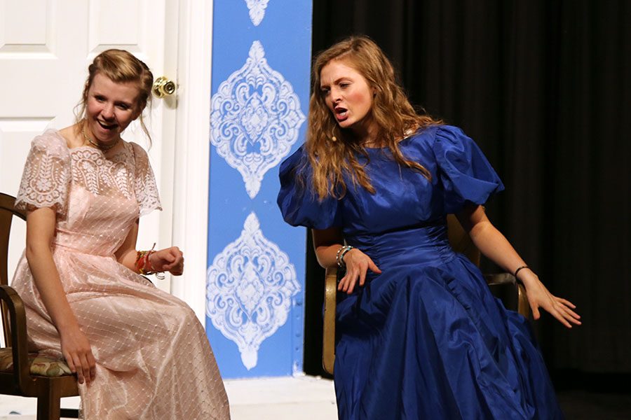 Caroline, played by sophomore Camryn Vitt, speaks with her sister Louisa, played by sophomore Annie Bogart, at Netherfield. 