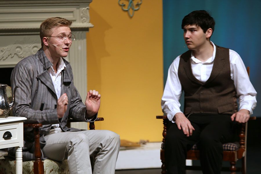 Mr. Collins, played by junior Jack Mahoney, speaks with Mr. Bennet, played by senior Graham Wilhauk.