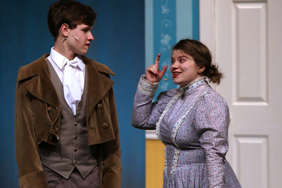 Mrs. Bennet, played by junior Lindsey Edwards, invites Mr. Bingley, played by junior Noah Smith, to stay for dinner.