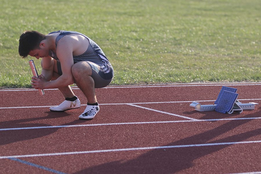 Before the 4x100, junior Henry Lopez gathers his focus. The boys 4x100 placed fifth, while the 4x400 placed second and the 4x800 placed third.