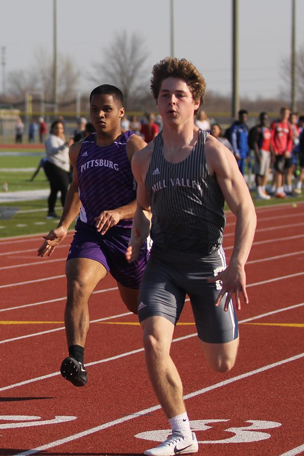 Junior Steven Colling runs the boys 100 meter dash. Colling placed ninth.