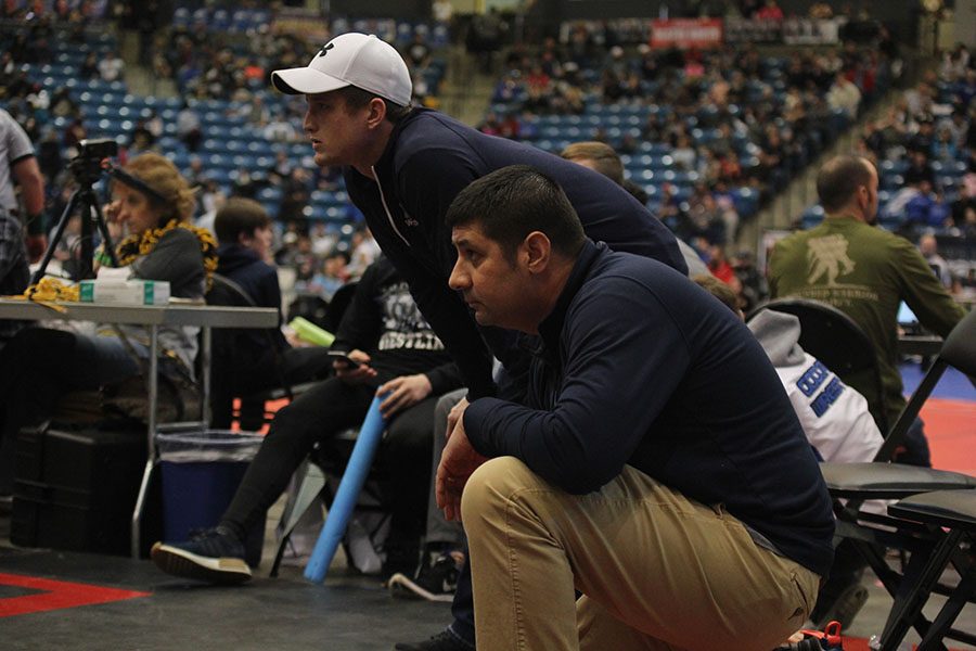 During+the+5A+state+wrestling+tournament+on+Saturday%2C+Feb+24%2C+head+coach+Travis+Keal+watches+a+match.