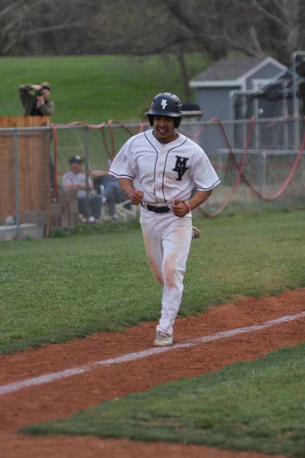 Junior Johnathan Contreras runs to home base.