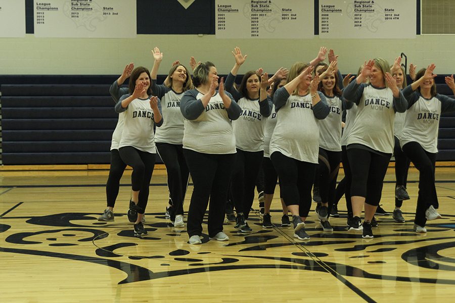 The Silver Stars moms dance in the Silver Stars Mom routine.