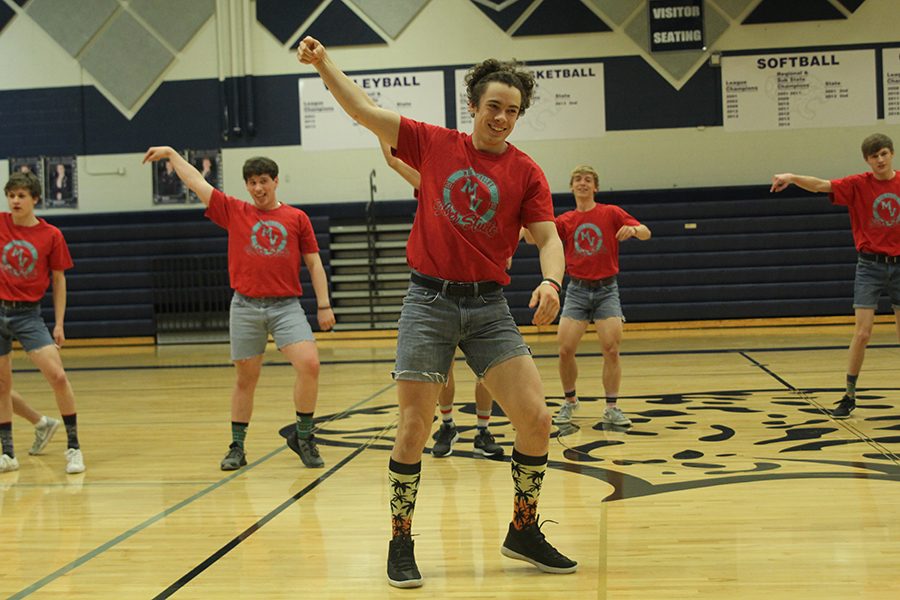 Senior Luke Guilford performs in the Silver Stud routine. 