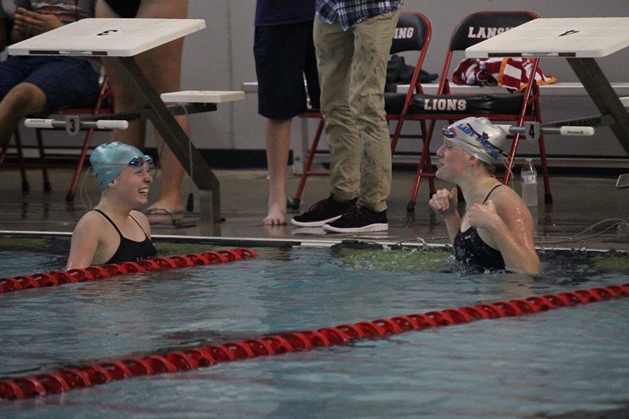 Sophomores Kayla Teasley and Allison Godfrey get excited after seeing their times, both under a minute.