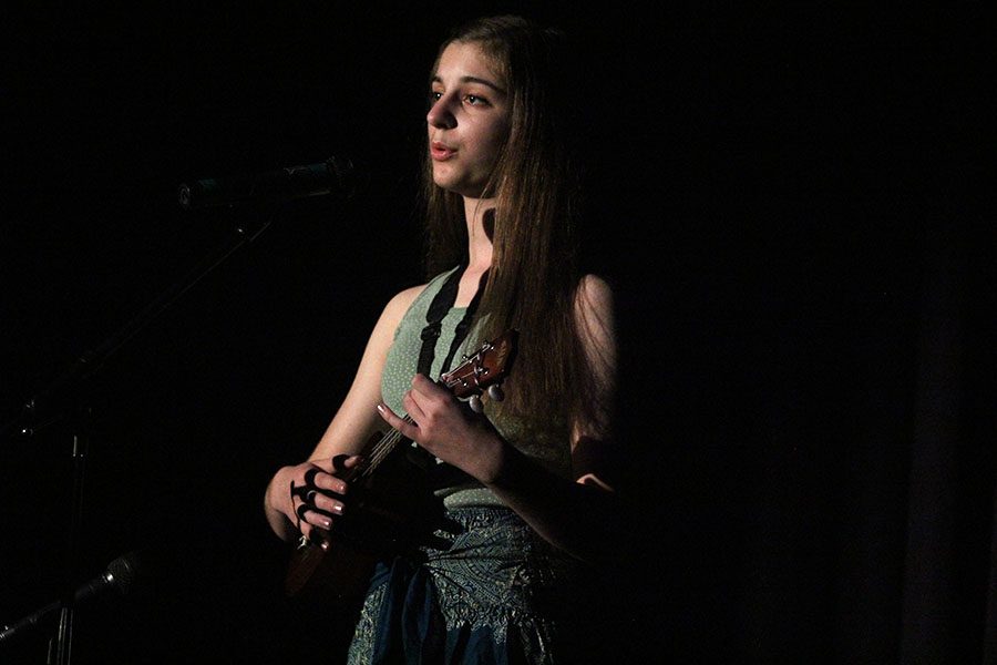 While playing the ukulele, junior Sarah Gawith sings her own original song. 