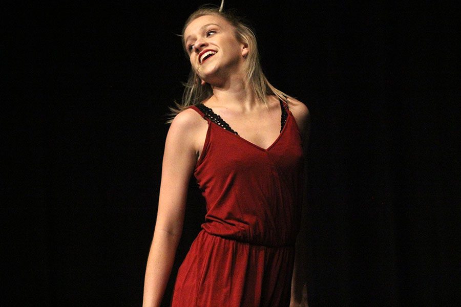 During her dance performance, junior Bella Line turns toward the crowd and smiles.