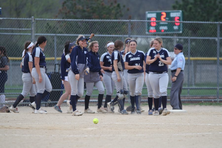 After winning two of their games against Saint James Academy Tuesday, May 1st, the softball team smiles as they walk on the field. 