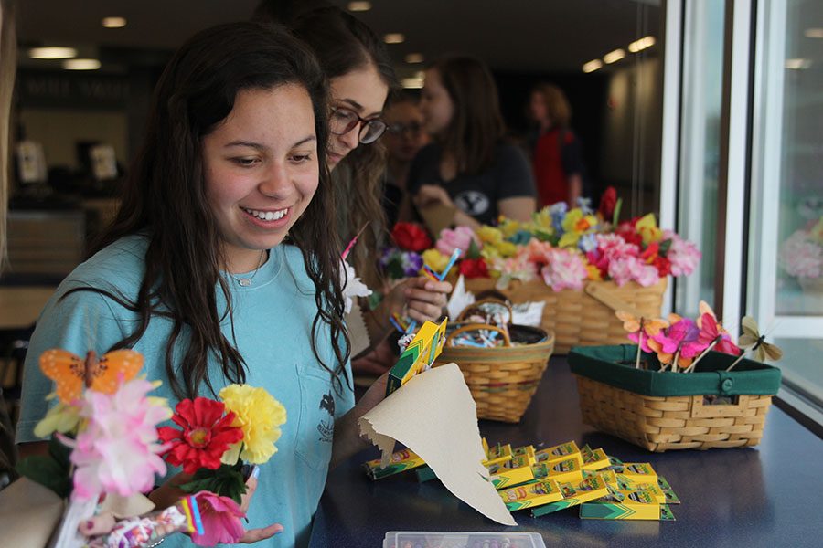 Sophomore Cristina Talavera picks up some markers to decorate her May Basket on Tuesday, May 1. 