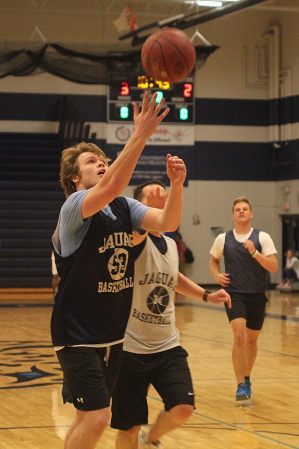 Running towards the basket, senior Cooper Kaifes scores off a lay up.