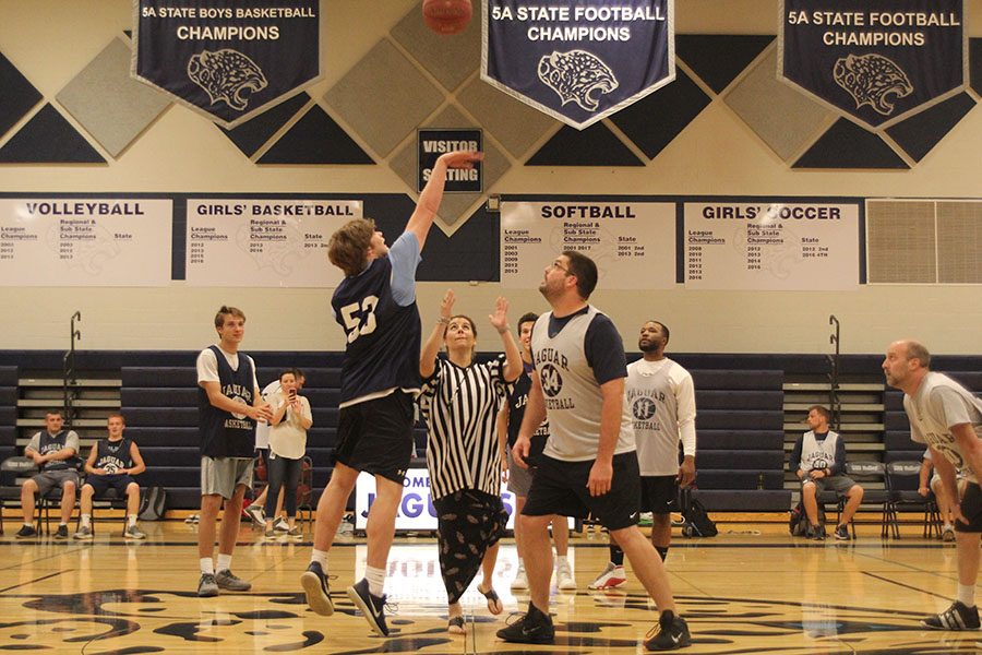 Jumping for the tip off, senior Cooper Kaifes attains possession of the ball at the beginning of the scrimmage.