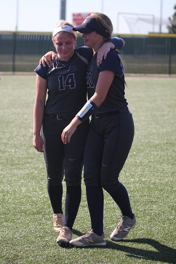 - At the conclusion of the game and awards ceremony, senior Peyton Moeder and junior Haley Puccio embrace.