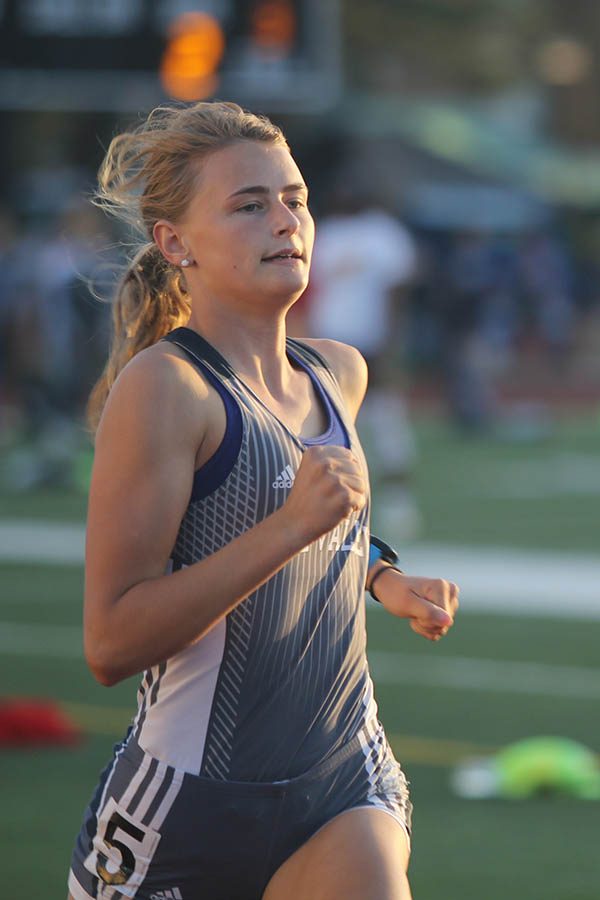 Senior Bella Hadden runs during the 400m race.