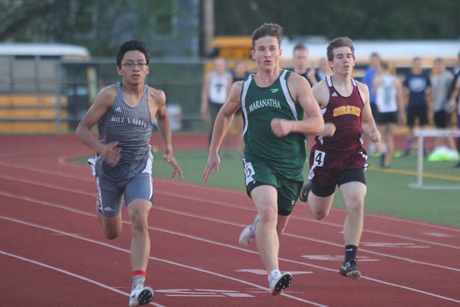 Sophomore Nico Gatapia attempts to pass two runners during his event.