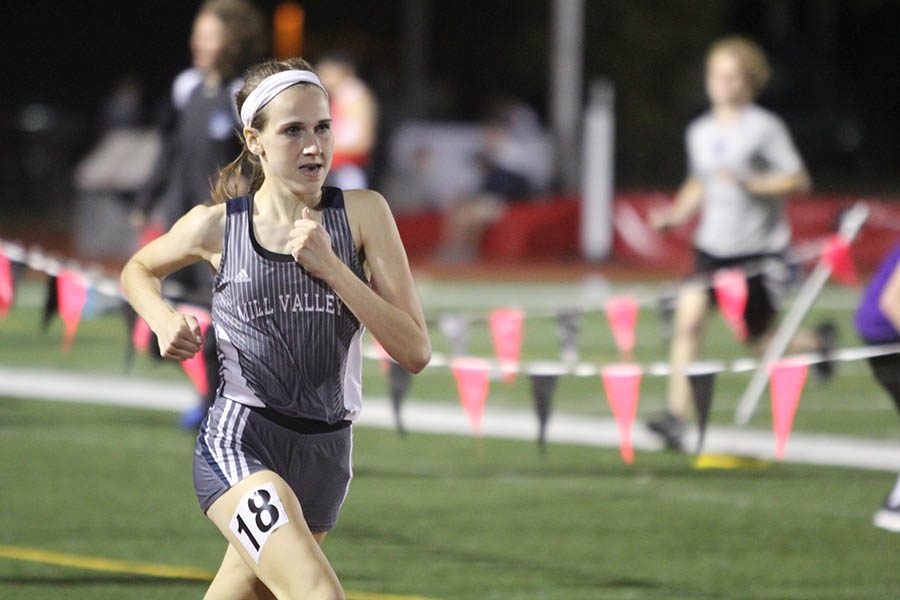 During her event, sophomore Morgan Koca runs on the track.