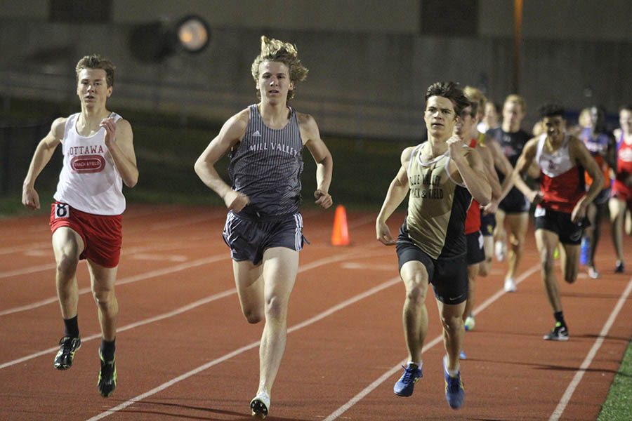 During his event, senior Mitchell Dervin passes two opponents. 