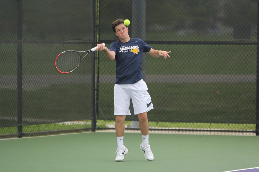 During his singles match on Friday, May 4, sophomore Joey Gillette prepares to make contact with the ball.