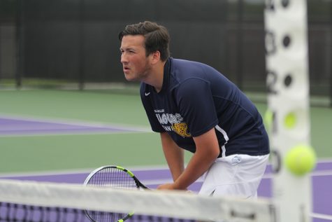 As he waits for his doubles partner senior Drake Brizendine to serve the ball, junior Jacob Hoffman keeps his eye on the De Soto player. The boys competed in the regionals tournament from Thursday, May 3 to Friday, May 4 at Pittsburg High School.