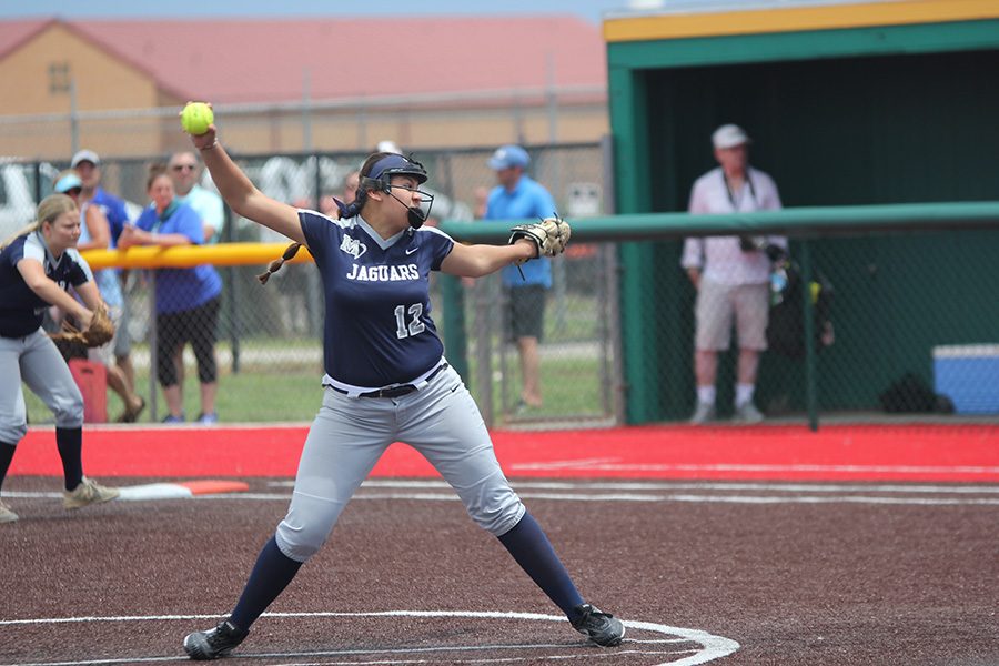 With the ball in hand, sophomore Lauren Florez gears up to pitch the ball. 