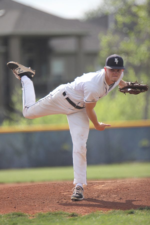 To open the game, senior Connor Nekola pitches.