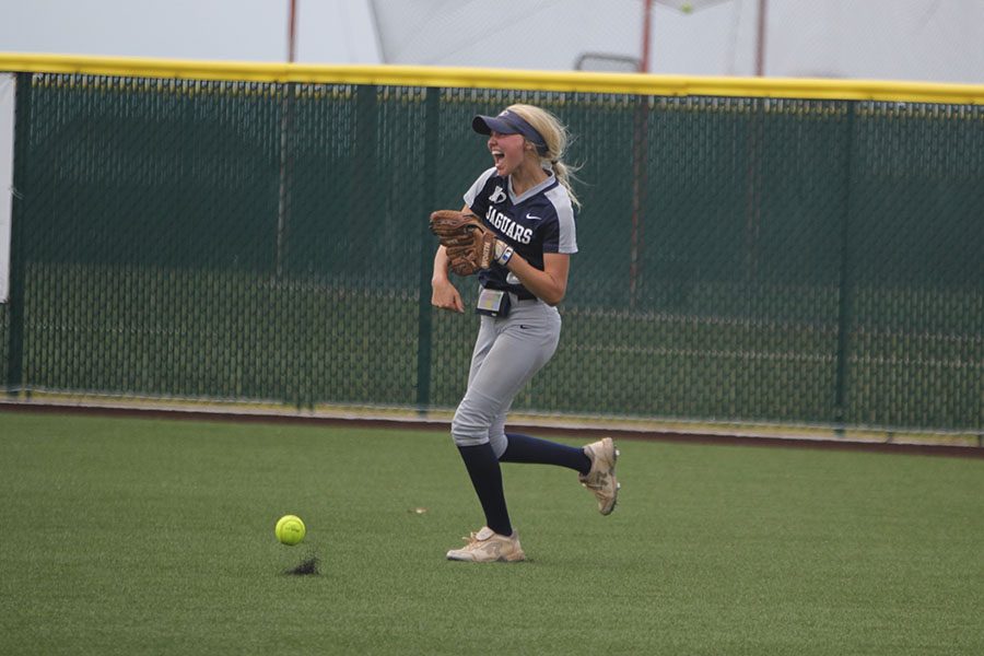 To celebrate her game winning catch, senior Lilly Blecha throws the ball on to the ground.