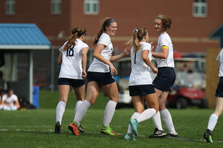 After scoring a goal against the Lansing Lions on Thursday, May 3, the team celebrates.