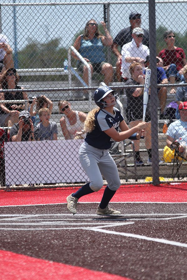 After hitting the ball, junior Haley Puccio looks up to see where the ball will land.