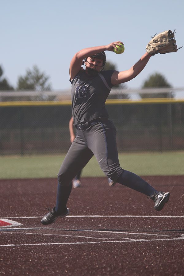 Sophomore Lauren Florez pitches the ball to Topeka Seaman opponent.