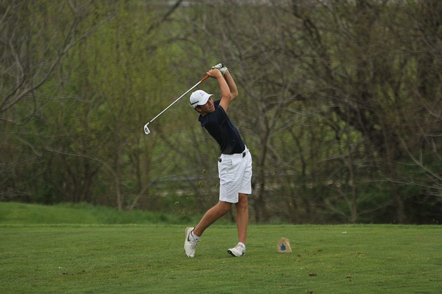 During his first year on the golf team, freshman Nick Mason Tees off. 