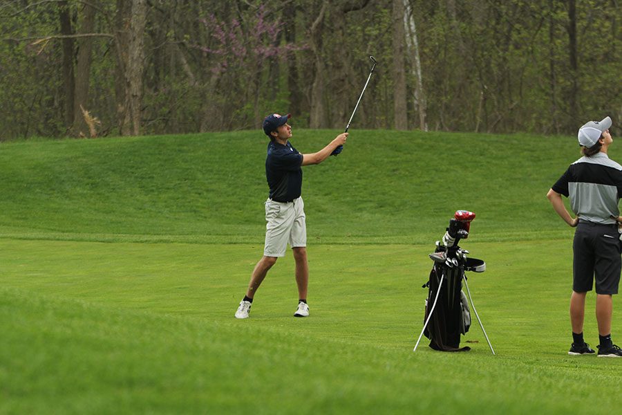 After hitting the ball, senior Kyle Bonnstetter watches where the ball is going to land. 