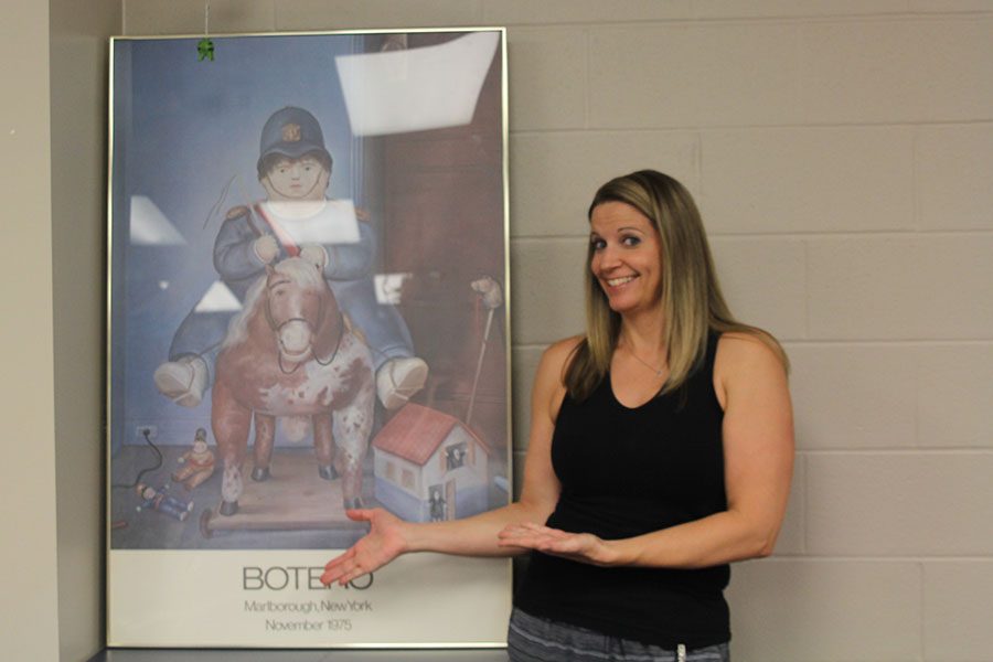 Spanish teacher Aly Young shows of her favorite decoration in her classroom on Monday Aug. 7, a painting of a toy horse. 