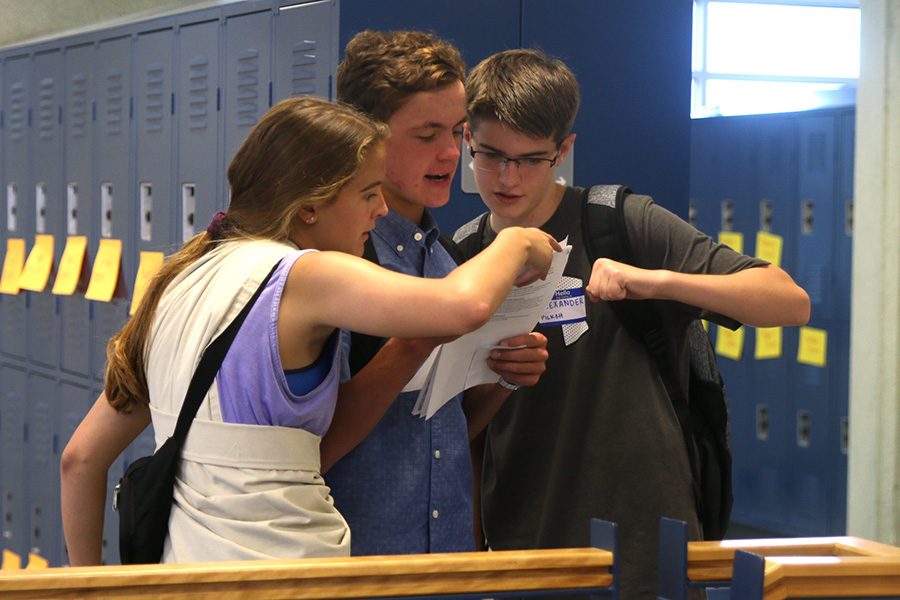 Senior Abby Layton helps a freshman find their class during orientation. 