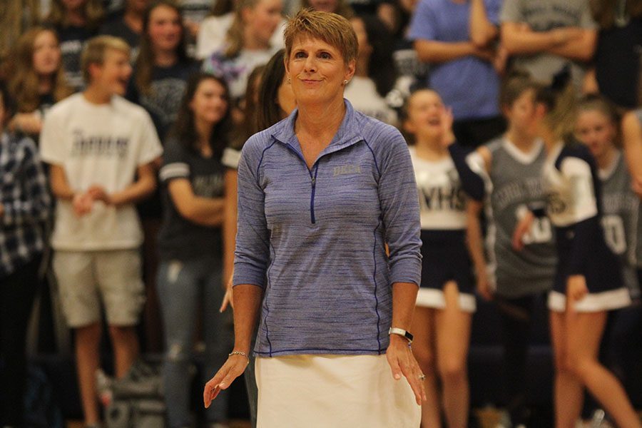 Feeling the beat of the music, business teacher Diana Heffernon-Meyers dances during the homecoming assembly.