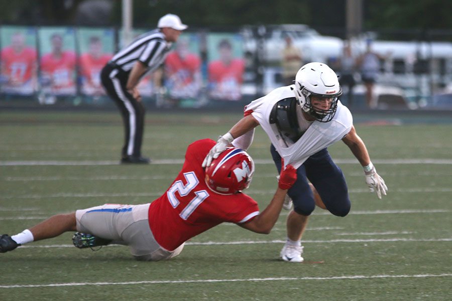 Breaking free from a defender, senior Steven Colling rushes down the field on Friday, Sept. 15. The Jags lost to Bishop Miege with 40-7. 