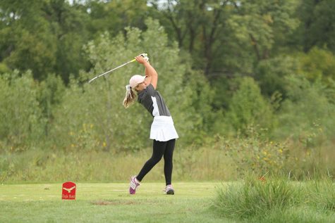 On Wednesday, Sept. 26, junior Hannah Davie hits from the twelfth tee box at Eagle Bend Country Club in Lawrence. Junior Hannah Davie placed 39th out of 132 golfers. Overall, the team did great. We had a couple of personal bests and our team score was one of our lowest all season. said Davie. Personally, there are many things I would like to improve on, but I am happy with how I finished.
