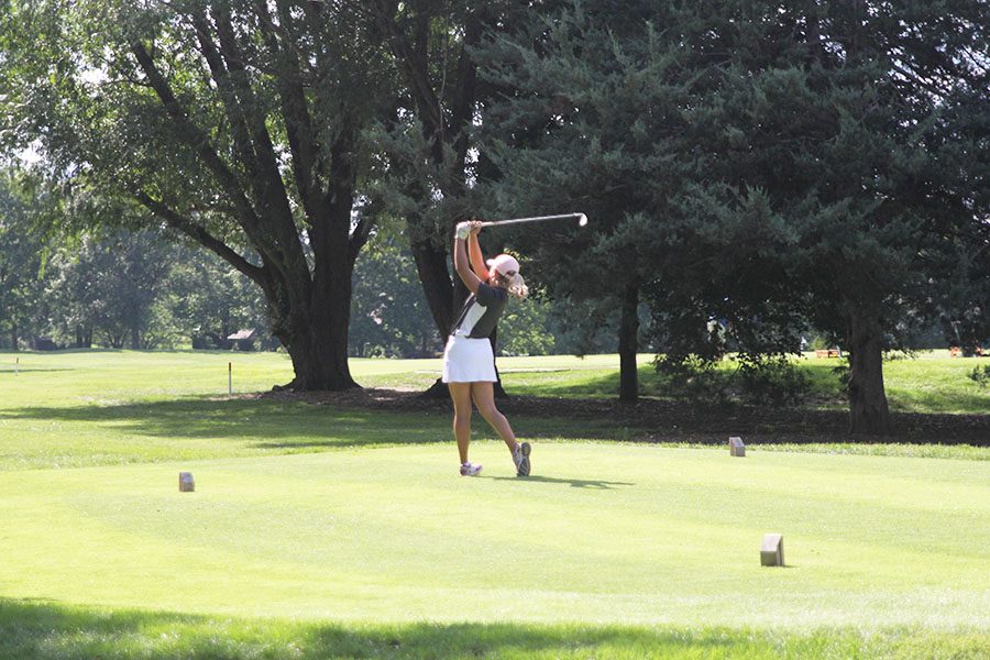 Halfway through the rigorous Leawood Community Center Golf Course, sophomore Megan Haymaker tees off on hole number 10 on Tuesday, Sept. 11.