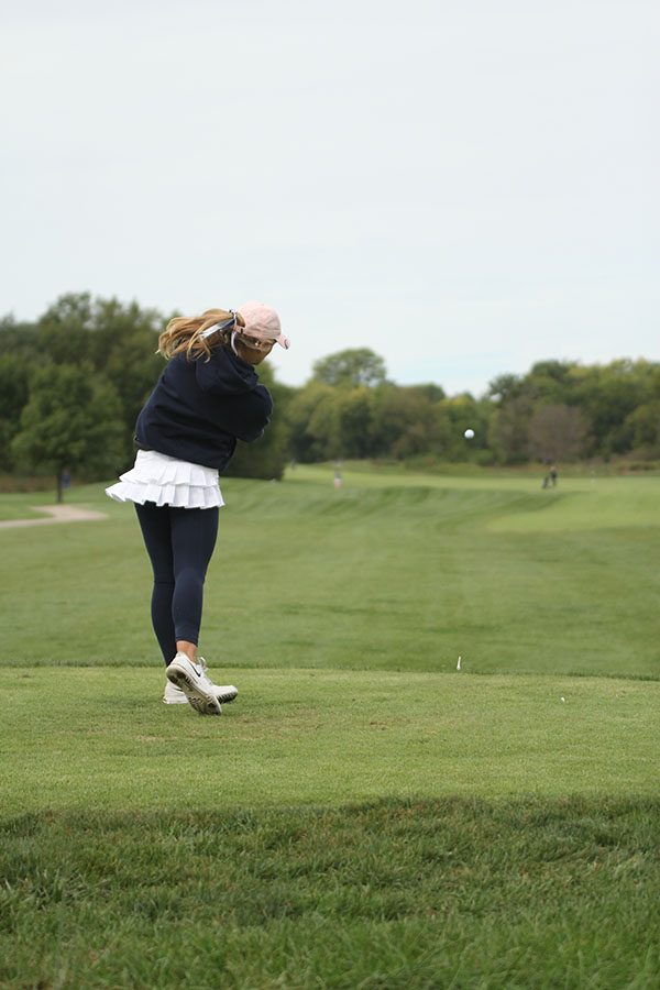 Teeing off, sophomore Caroline Lawson drives the ball down the fairway.