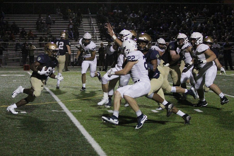 After the Jaguars punt, senior defensive back Ryan Bauer rushes to meet the Saints returner.